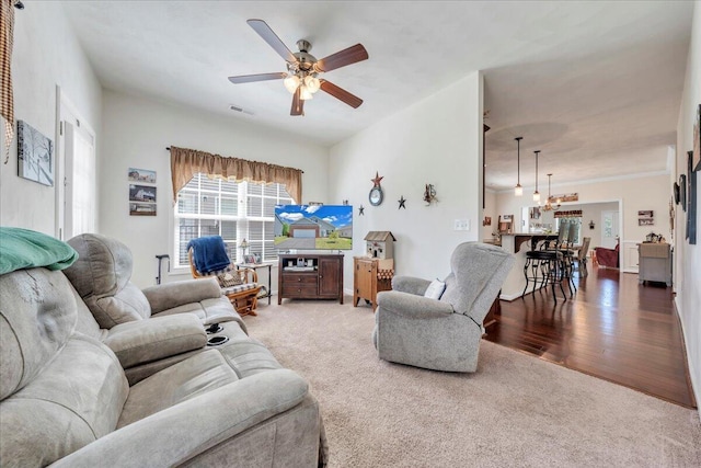 8355 Leighburn Dr, Roanoke, VA 24019 - living room featuring a ceiling fan, carpet, a chandelier, and wood finished floors