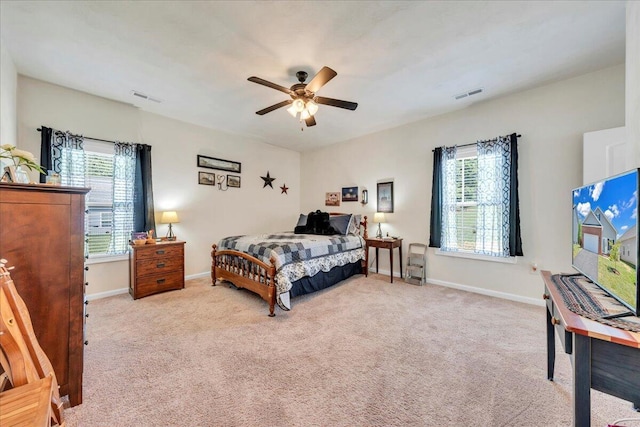 8355 Leighburn Dr, Roanoke, VA 24019 - bedroom with multiple windows, light colored carpet, and ceiling fan