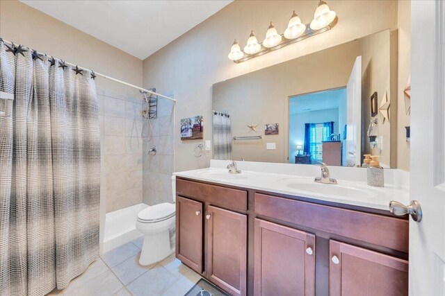 8355 Leighburn Dr, Roanoke, VA 24019 - bathroom featuring double vanity, tiled shower, and tile patterned floors