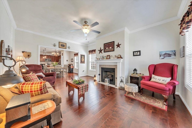 8355 Leighburn Dr, Roanoke, VA 24019 - living room featuring ceiling fan, healthy amount of natural light, dark wood-style flooring, a tile fireplace, and ornamental molding