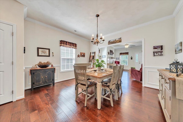 8355 Leighburn Dr, Roanoke, VA 24019 - dining space with healthy amount of natural light, dark wood-style flooring, ornamental molding, a chandelier, and ceiling fan