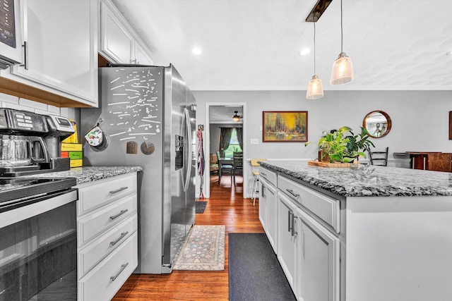 2343 Circle Dr SW, Roanoke, VA 24018 - kitchen with dark wood-type flooring, a kitchen island, white cabinets, ornamental molding, and light stone counters