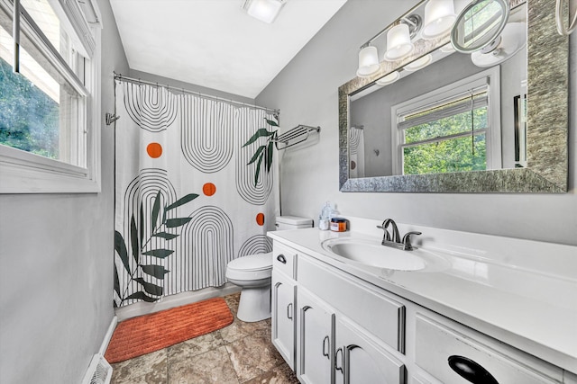 2343 Circle Dr SW, Roanoke, VA 24018 - bathroom featuring vanity, vaulted ceiling, and stone finish floors