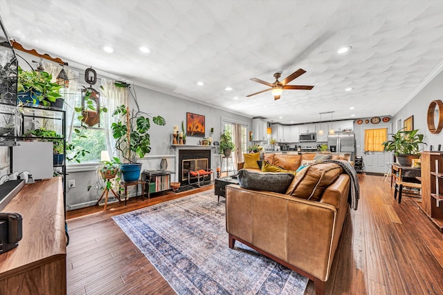 2343 Circle Dr SW, Roanoke, VA 24018 - living room featuring ceiling fan, ornamental molding, a glass covered fireplace, wood-type flooring, and recessed lighting