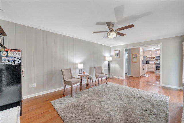 245 Queen Regent Ct, Blue Ridge, VA 24064 - sitting room with a ceiling fan, crown molding, and light wood finished floors