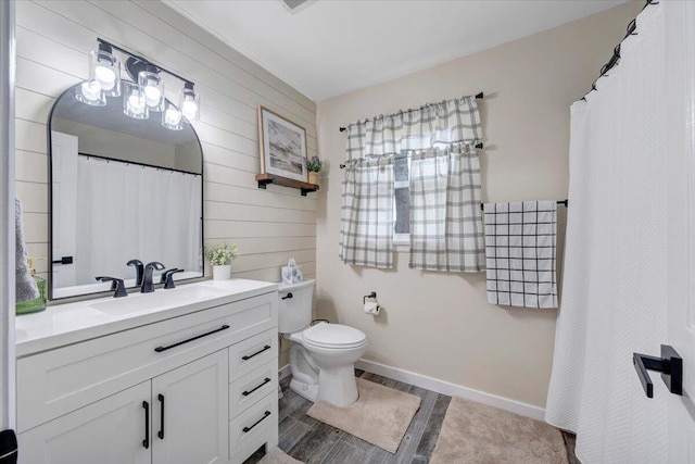 245 Queen Regent Ct, Blue Ridge, VA 24064 - bathroom with vanity, wood walls, and wood finished floors