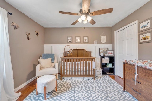 245 Queen Regent Ct, Blue Ridge, VA 24064 - bedroom featuring wood finished floors, a crib, and ceiling fan