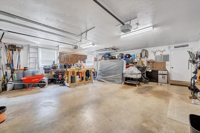 245 Queen Regent Ct, Blue Ridge, VA 24064 - garage featuring a garage door opener and a workshop area