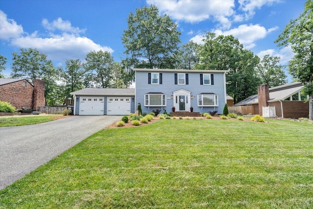 245 Queen Regent Ct, Blue Ridge, VA 24064 - colonial house featuring an attached garage and asphalt driveway