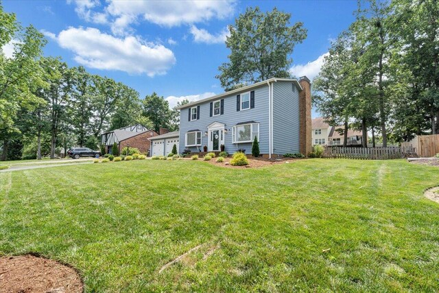 245 Queen Regent Ct, Blue Ridge, VA 24064 - colonial-style house featuring a chimney and a garage
