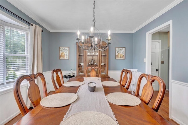 245 Queen Regent Ct, Blue Ridge, VA 24064 - dining space with a chandelier, wood finished floors, wainscoting, and crown molding