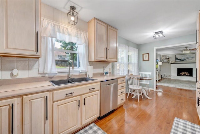 245 Queen Regent Ct, Blue Ridge, VA 24064 - kitchen featuring stainless steel dishwasher, light brown cabinets, tasteful backsplash, light countertops, and light wood-style flooring