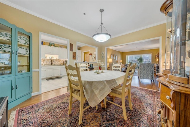 3040 Mcvitty Forest Dr Unit 211, Roanoke, VA 24018 - dining space with light wood finished floors and ornamental molding
