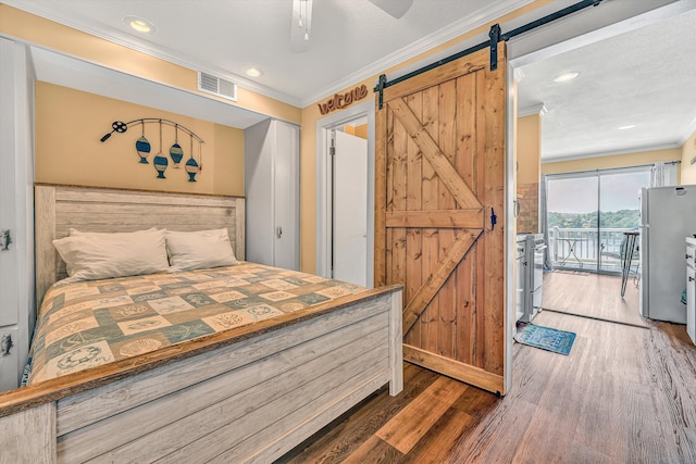 1085 Bluewater Dr Unit 220, Moneta, VA 24121 - bedroom with a barn door, ornamental molding, freestanding refrigerator, access to outside, and wood finished floors