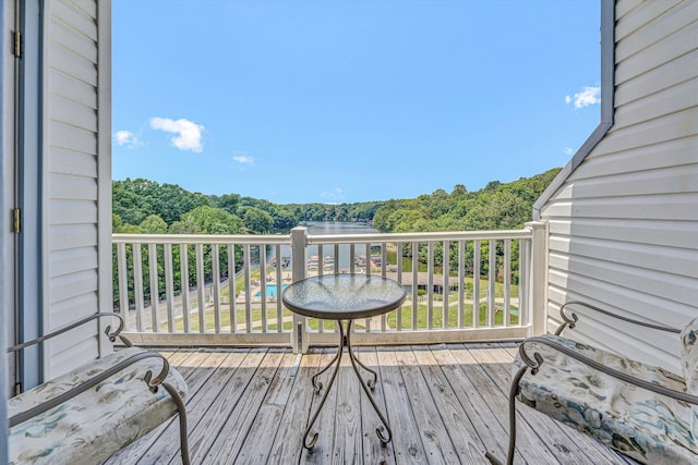1085 Bluewater Dr Unit 220, Moneta, VA 24121 - wooden terrace with a wooded view and a water view