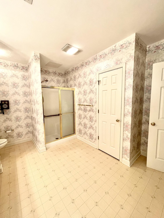 4845 Glen Ivy Ln SW Unit 209, Roanoke, VA 24018 - bathroom with a shower stall, wallpapered walls, and tile patterned floors