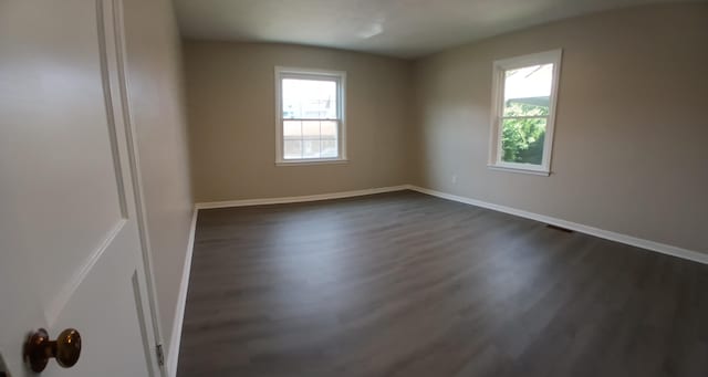 214 E Madison St, Covington, VA 24426 - empty room with dark wood finished floors