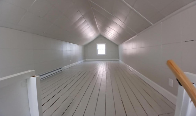 214 E Madison St, Covington, VA 24426 - additional living space with vaulted ceiling, hardwood / wood-style flooring, and baseboard heating
