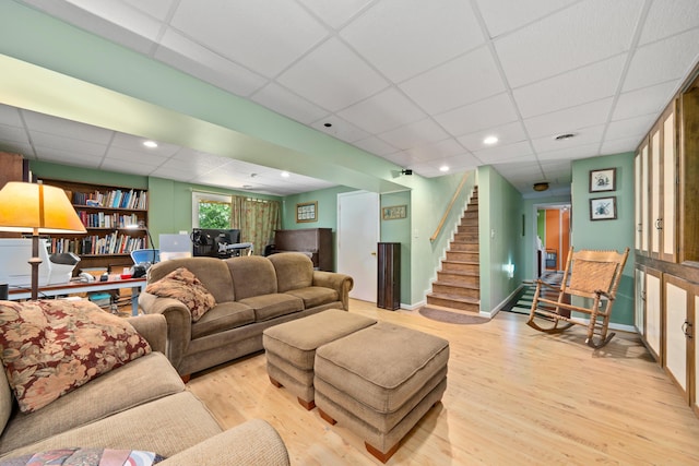 73 Bounty Ct, Roanoke, VA 24019 - living area with a drop ceiling, wood finished floors, and stairs