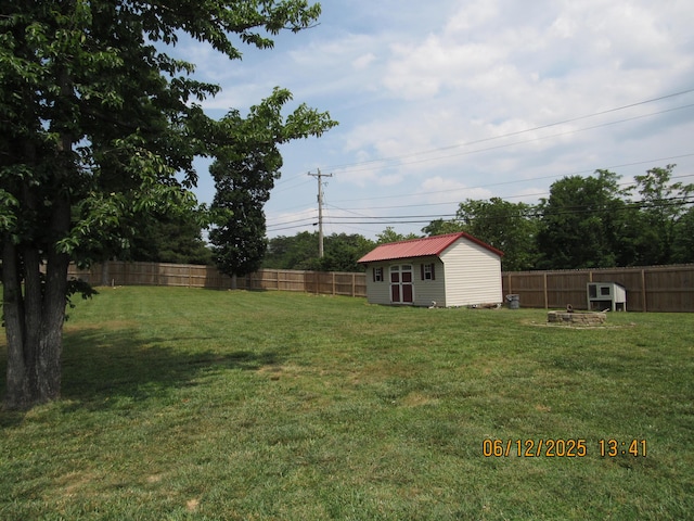 5605 Prunty Dr, Salem, VA 24153 - fenced backyard with a storage unit and an outdoor fire pit
