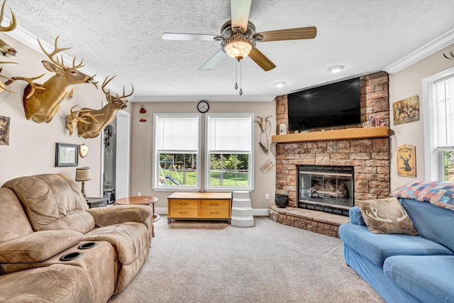 1060 Marble Creek Ct, Lynch Station, VA 24571 - carpeted living room featuring a textured ceiling, ornamental molding, a ceiling fan, and a stone fireplace