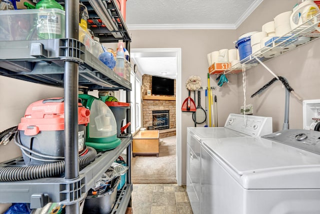 1060 Marble Creek Ct, Lynch Station, VA 24571 - washroom featuring washing machine and clothes dryer, a stone fireplace, ornamental molding, stone finish floors, and a textured ceiling