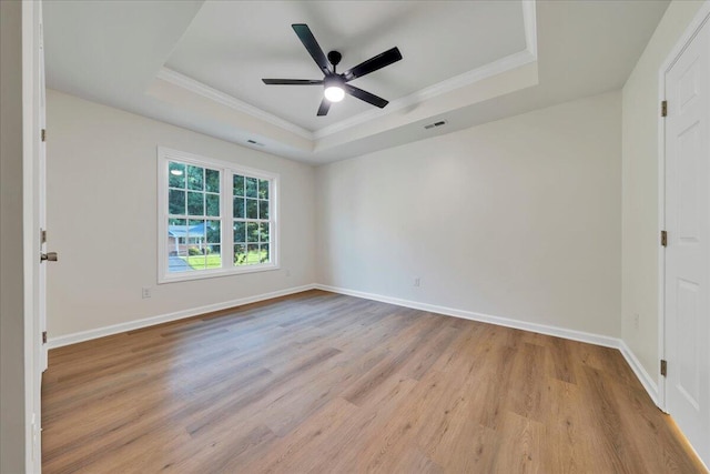 3713 Pinevale Rd, Roanoke, VA 24018 - unfurnished room with a raised ceiling, wood finished floors, crown molding, and ceiling fan