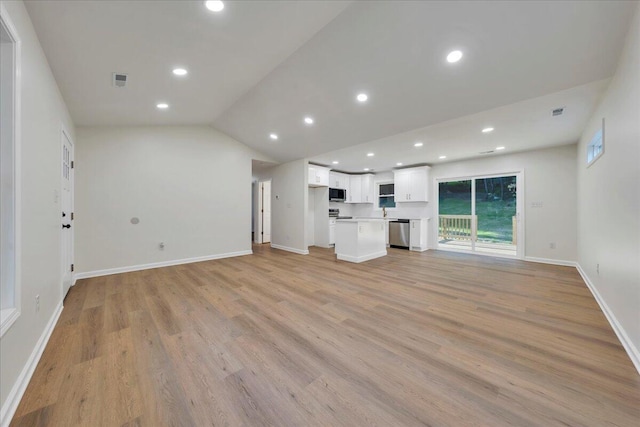 3713 Pinevale Rd, Roanoke, VA 24018 - unfurnished living room with lofted ceiling, light wood finished floors, and recessed lighting
