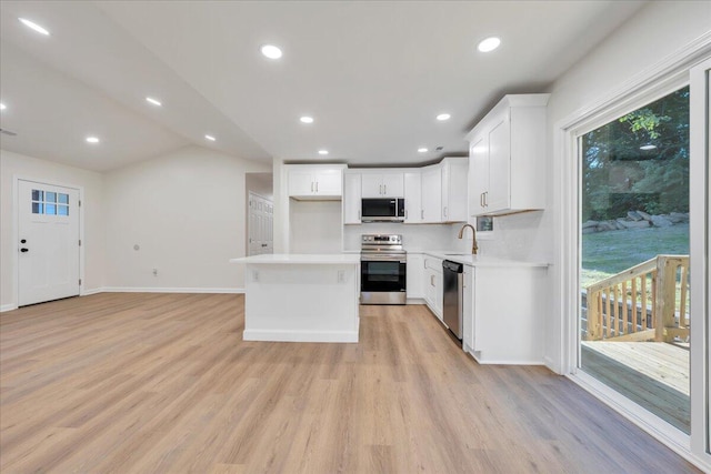3713 Pinevale Rd, Roanoke, VA 24018 - kitchen with appliances with stainless steel finishes, light wood-type flooring, light countertops, plenty of natural light, and vaulted ceiling