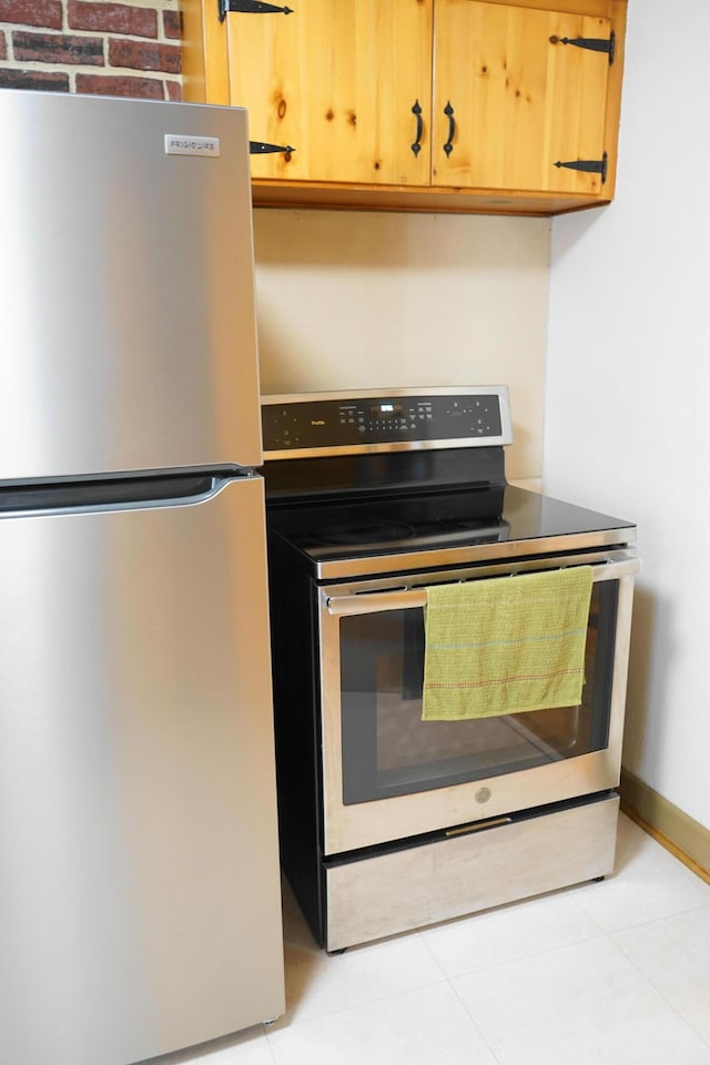 520 S Poplar St, Vinton, VA 24179 - kitchen featuring appliances with stainless steel finishes and light tile patterned flooring