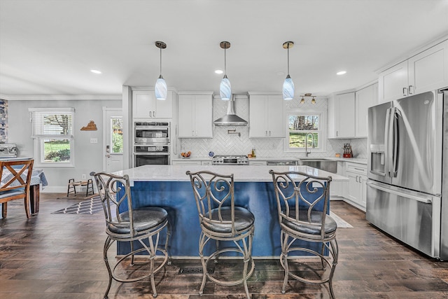 10610 Slings Gap Rd, Bent Mountain, VA 24059 - kitchen featuring appliances with stainless steel finishes, a center island, tasteful backsplash, white cabinetry, and crown molding