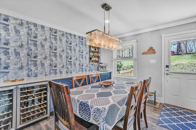 10610 Slings Gap Rd, Bent Mountain, VA 24059 - dining space featuring a bar, wood finished floors, crown molding, and wine cooler