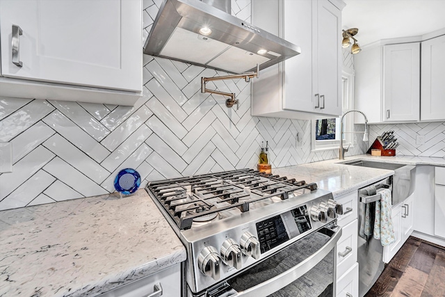 10610 Slings Gap Rd, Bent Mountain, VA 24059 - kitchen featuring appliances with stainless steel finishes, ventilation hood, decorative backsplash, and light stone countertops