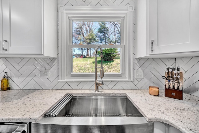 10610 Slings Gap Rd, Bent Mountain, VA 24059 - kitchen with tasteful backsplash, white cabinets, and light stone counters