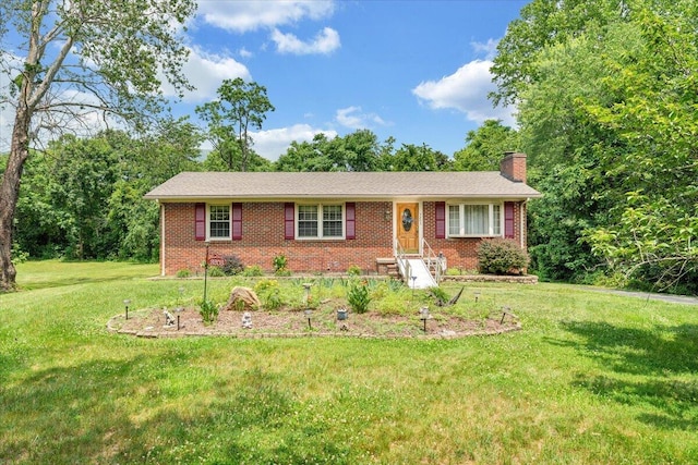 3203 Bradshaw Rd, Salem, VA 24153 - ranch-style house featuring a chimney, brick siding, and a front yard