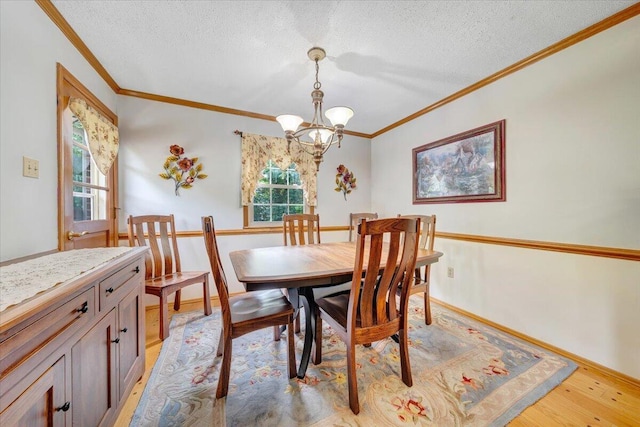 3203 Bradshaw Rd, Salem, VA 24153 - dining area featuring ornamental molding, a chandelier, a textured ceiling, and light wood-type flooring