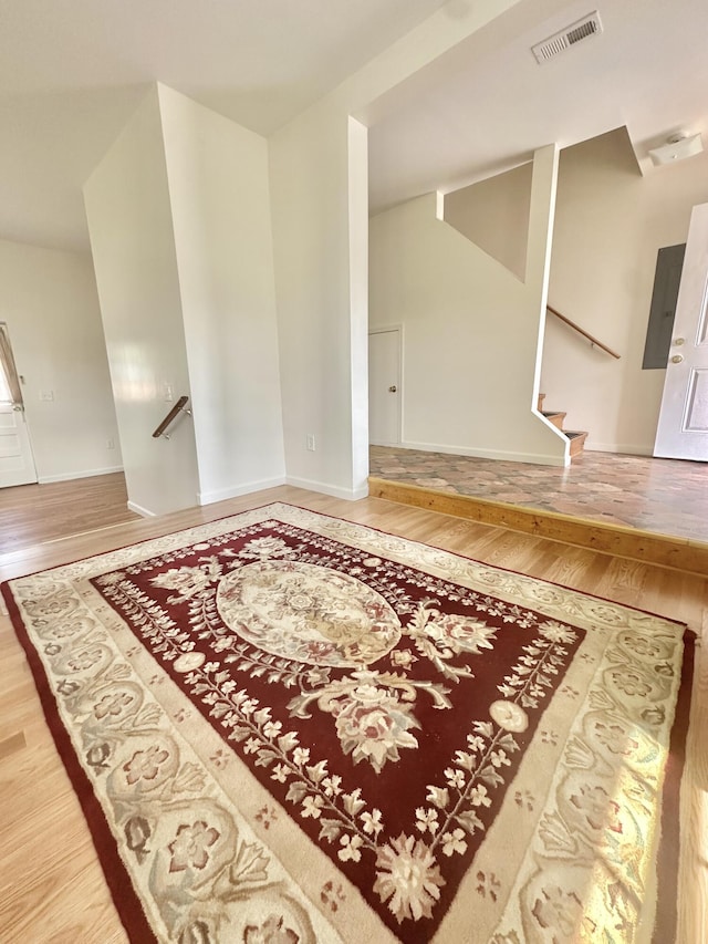 418 Marshall Ave, New Castle, VA 24127 - entryway with wood finished floors, electric panel, and stairway