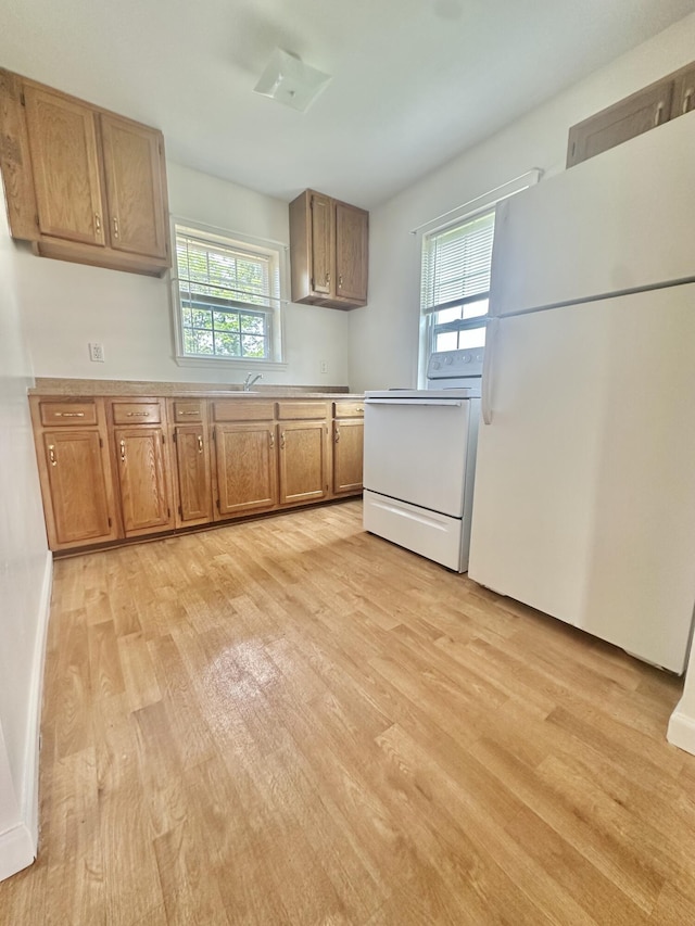 418 Marshall Ave, New Castle, VA 24127 - kitchen with white appliances, light wood-type flooring, plenty of natural light, and light countertops