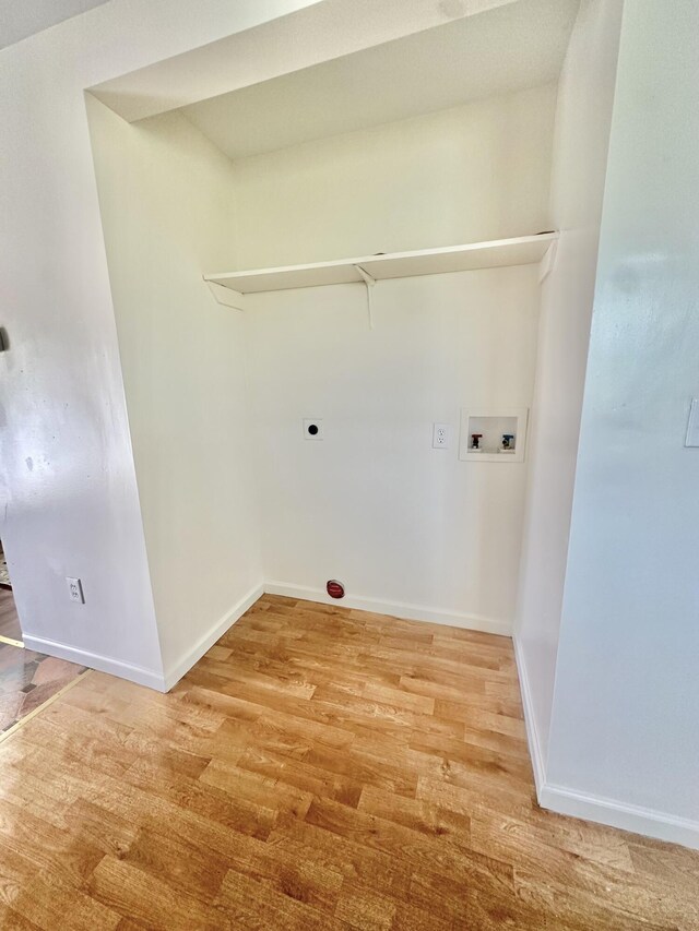 418 Marshall Ave, New Castle, VA 24127 - laundry area with hookup for a washing machine, light wood finished floors, and electric dryer hookup