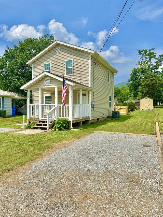 418 Marshall Ave, New Castle, VA 24127 - view of front facade with crawl space, a storage unit, and a porch