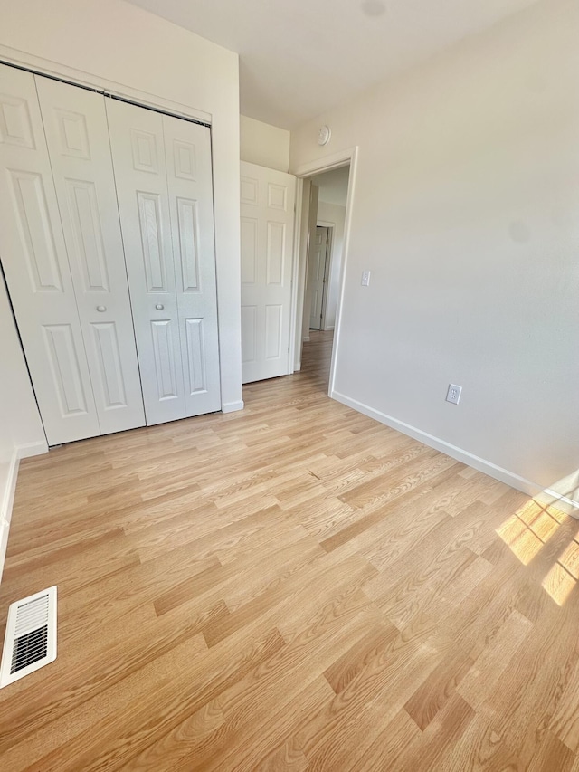 418 Marshall Ave, New Castle, VA 24127 - unfurnished bedroom featuring light wood-type flooring and a closet