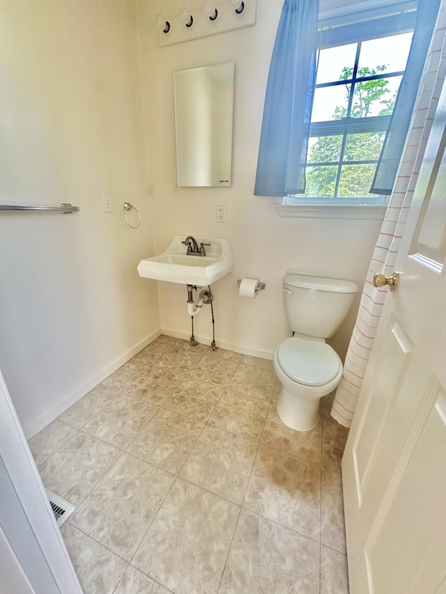 418 Marshall Ave, New Castle, VA 24127 - half bath with toilet and tile patterned flooring