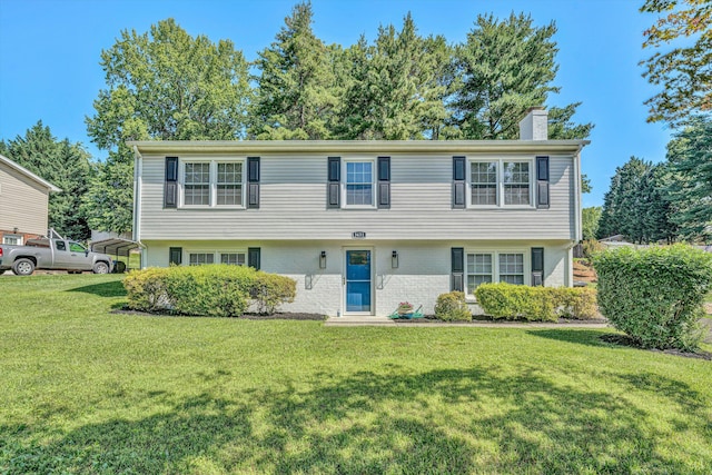 3631 Bower Rd, Roanoke, VA 24018 - colonial inspired home featuring a chimney, a front yard, and brick siding