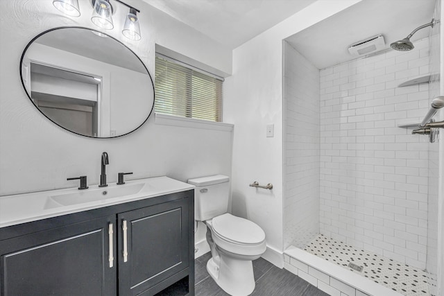 3631 Bower Rd, Roanoke, VA 24018 - bathroom featuring tiled shower, vanity, and tile patterned flooring