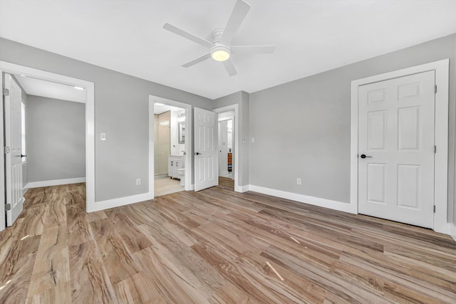 3631 Bower Rd, Roanoke, VA 24018 - unfurnished bedroom featuring light wood-type flooring, a spacious closet, ensuite bath, and ceiling fan