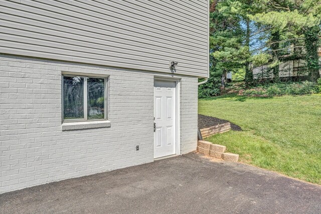 3631 Bower Rd, Roanoke, VA 24018 - entrance to property with a patio, a yard, and brick siding