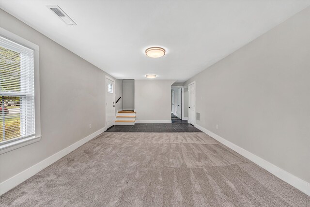3631 Bower Rd, Roanoke, VA 24018 - basement with dark carpet, stairway, and healthy amount of natural light
