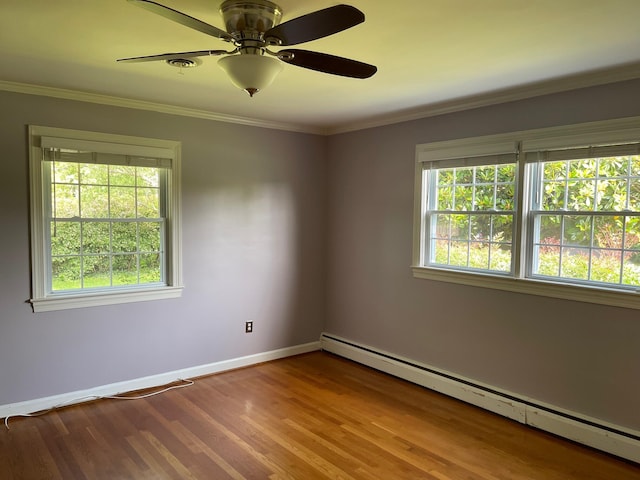 3210 Orchard Hill Rd SW, Roanoke, VA 24018 - spare room featuring baseboard heating, plenty of natural light, wood finished floors, a ceiling fan, and crown molding