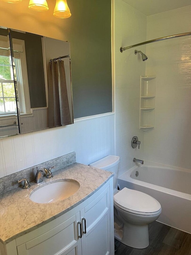3210 Orchard Hill Rd SW, Roanoke, VA 24018 - bathroom featuring vanity, wainscoting, shower / bathtub combination with curtain, and wood finished floors