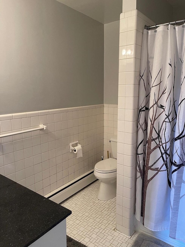 3210 Orchard Hill Rd SW, Roanoke, VA 24018 - full bathroom featuring a baseboard heating unit, tile walls, wainscoting, vanity, and a shower with shower curtain